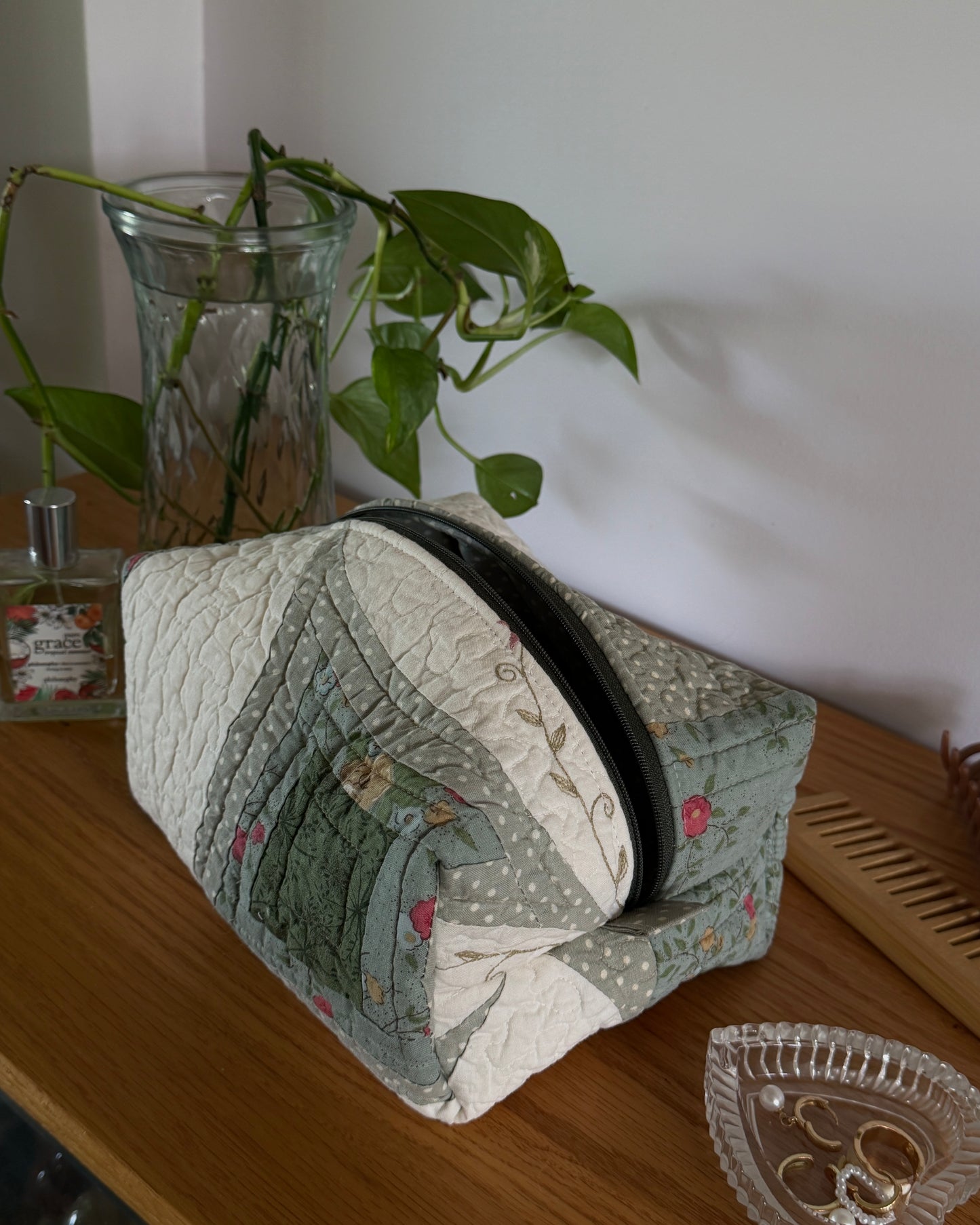 green quilted makeup bag