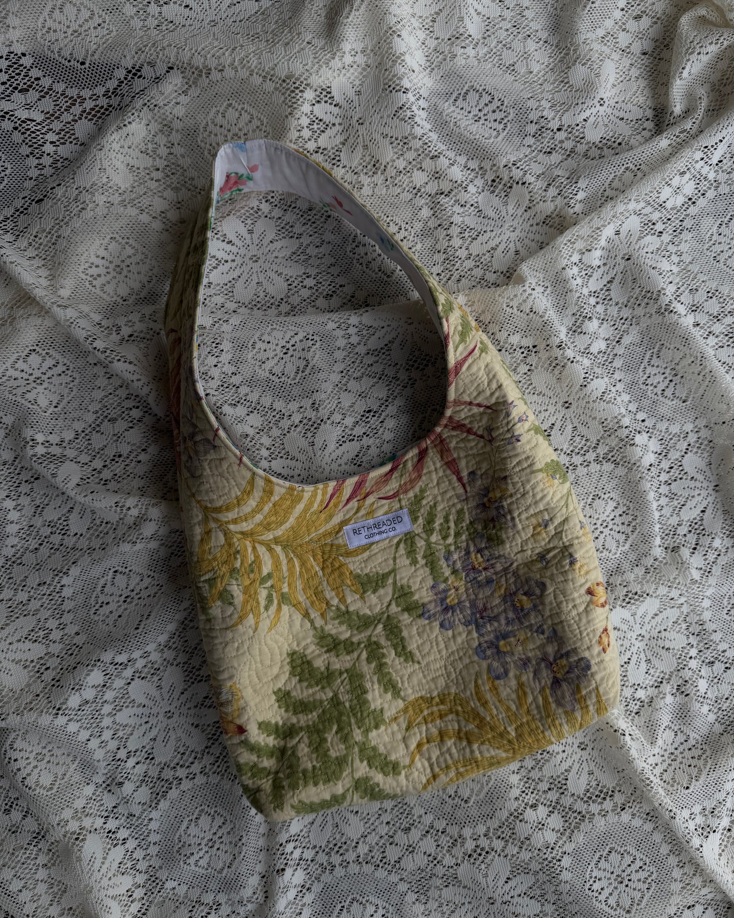 yellow quilted hobo bag
